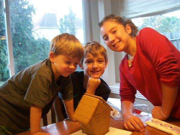 kids building a gingerbread house
